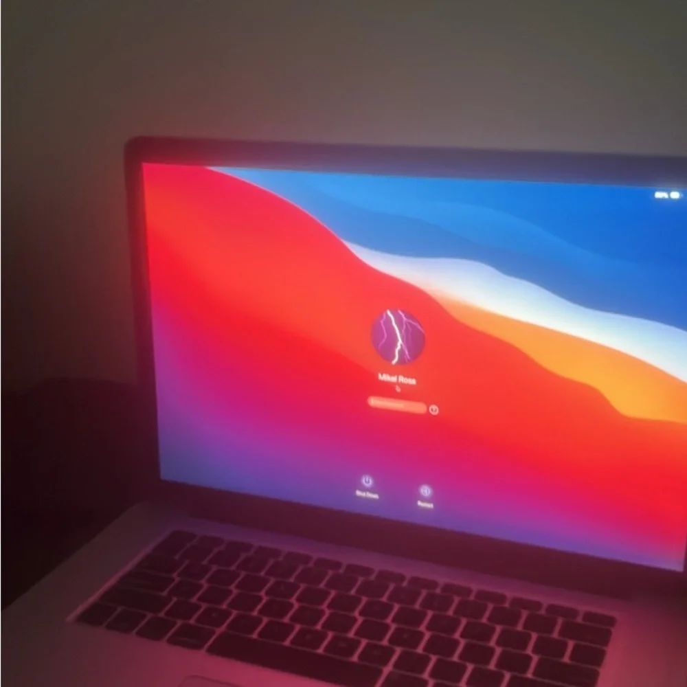 Apple Laptop with Red and Blue Keyboard Glow